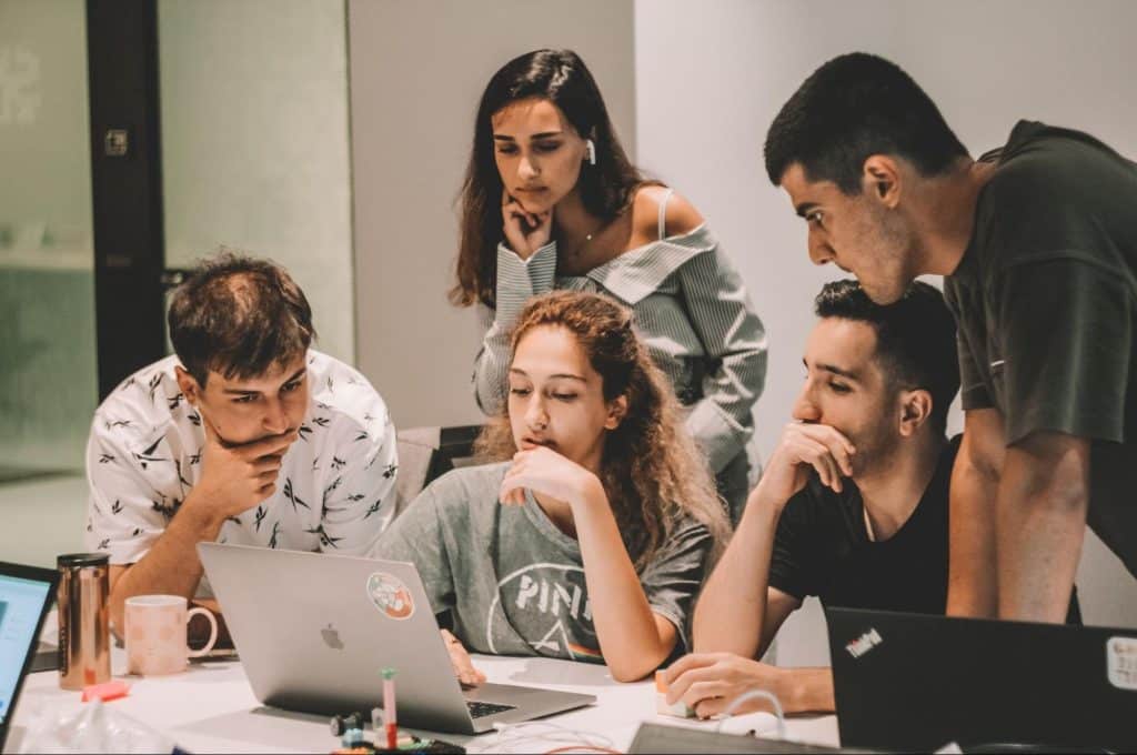 team discussinsg how to prevent negative comments from ruining brand equity